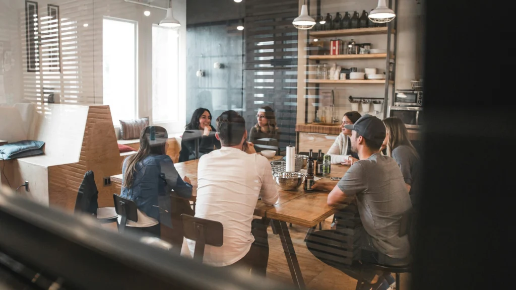 Software team discussing a project around a table
